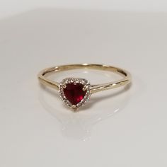 Thanks for shopping our vintage estate store. We tend to sell well below wholesale and truly hope you enjoy all of our items. Many of the items are one of a kind, so please enjoy scrolling through the pictures and hopefully something will catch your eye. Black spots are from reflections. Beautiful estate 14k yellow white gold created ruby .25ct heart with .10ct cz diamond ring. The ring is truer to the first picture, dark red garnet.   Ring size: 7 Ruby is size 7  Setting: 1/4" 6.5mm Band width: Red Promise Rings, Red Gold Ring, Dark Red Ring, Red Heart Engagement Ring, Blair Waldorf Ruby Ring, Heart-shaped Ruby Ring For Proposal, Yellow Gold Heart-shaped Ruby Ring, Heart-shaped Red Ruby Ring, Gold Heart-shaped 14k Gold Ruby Ring