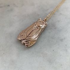 Buy in 14K Gold. For thousands of years, the cicada has been a symbol of change, renewal, rebirth, metamorphosis, and transformation. Instead of one major metamorphosis, the cicada's 17-year life is marked by multiple moltings (or sheddings of old layers). On its 5th molting, it finally leaves the ground to emerge into the light.From there, they use their large eyes to seek full awareness of their surroundings. Through powerful song and strong communication, they show us what it is to use voice Cake Pull Charms, Cicada Necklace, Symbol Of Change, Soul Friend, South Louisiana, Bee Pendant, Large Eyes, First Humans, Birthstone Bracelets