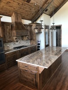 a large kitchen with wooden cabinets and an island in front of the stove top oven