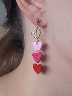 https://purplebeestudio.etsy.com Dainty earrings in bright red, raspberry and pink. Handcrafted from polymer clay with brass heart charm, ear posts and backs. The earrings are very light and comfortable to wear. Nice gift for your loved ones. All my earrings are handcrafted, sanded, buffed and polished with two layers of special semi-gloss varnish for better surface protection. Product care:  - To ensure the product quality and durablility, avoid contact with water, lotion, perfumes and household cleaners and chemicals. - You can clean the products with a slightly damp soft fabric.  - Sharp objects can damage the clay surface. - When not in use, store in a dry, seperate box. Thank you for visiting my shop! If you have any special requests, I'll be happy to do my best to accommodate. Cute Dangle Earrings For Valentine's Day, Fun Dangle Jewelry For Valentine's Day, Fun Handmade Jewelry For Valentine's Day, Playful Red Jewelry For Valentine's Day, Pink Heart Beads Earrings For Gifts, Fun Dangle Earrings For Valentine's Day, Playful Handmade Earrings For Valentine's Day, Handmade Fun Earrings For Valentine's Day, Playful Handmade Red Jewelry