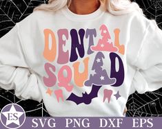 a woman wearing a white sweatshirt with the words dental squad printed on it in pink, purple and orange