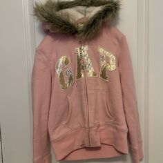 Gap Pink, Sherpa Lined, Faux Fur Zip Up Jacket With Shiny Gold Logo. Pink Winter Tops For Cold Weather, Pink Cozy Fit Outerwear For Spring, Cute Gap Tops For Fall, Cute Gap Outerwear For Fall, Cozy Pink Winter Tops, Gap Pink Tops For Fall, Pink Gap Tops For Fall, Pink Gap Sweatshirt For Winter, Pink Gap Zip Up