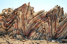 large rock formation in the middle of desert