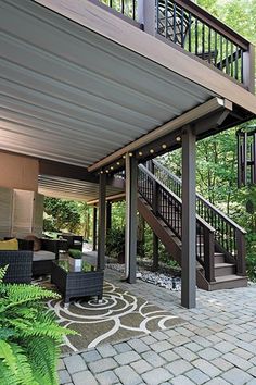 an outdoor living area with patio furniture and stairs