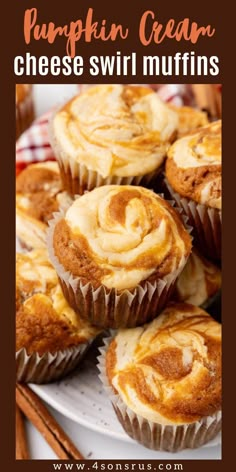 pumpkin cream cheese swirl muffins on a white plate with cinnamon sticks in the background