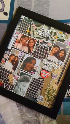 a black frame with pictures and stickers on it