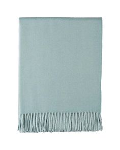 a light blue blanket with fringes on it