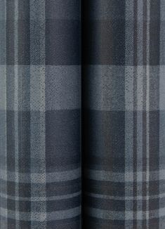 a close up view of the fabric on a plaid pattern material that is grey and black