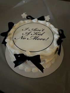 a white cake with black bows on it