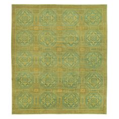 an area rug with green and gold designs on the front, in shades of blue