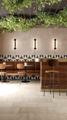 an empty restaurant with plants hanging from the ceiling and wooden booths on the wall,