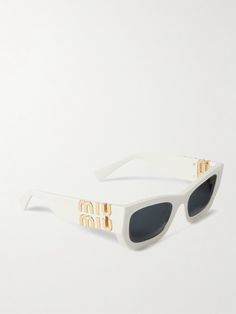 It's hard to beat the sartorial impact of a pair of statement sunglasses. Miu Miu's playfully named 'Glimpse' style take cues from old Hollywood, characterized by bold, oversized square frames. They're fitted with smoked UV-protective lenses and feature the label's moniker at the temples. Miu Miu Eyewear, Statement Sunglasses, Miu Miu Sunglasses, White Accessories, Butterfly Sunglasses, Acetate Sunglasses, Tinted Sunglasses, Eyewear Womens, Oval Frame