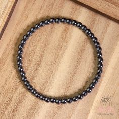 This hematite stone bracelet is a stunning accessory that will brighten up your wrist and your mood. It is handmade with high-quality elastic cord and has a comfortable fit. It measures about 6.5 ~ 7 inches in length and can stretch to fit most wrists. The bracelet is easy to wear and take off, as it has no clasp or closure. This bracelet is perfect for anyone who loves boho chic style, natural stones. It is a unique and meaningful gift for yourself or someone special. You can wear it alone or stack it with other bracelets for a layered look. - Made to Order - Material : Natural 4mm Hematite stone - Bracelet Length: fit for 6 ~ 7 inches wrist, elastic - Hand Woven Bracelet with Love and Sincerity - Due to different light and screen, the color may be slightly different from the picture. - E Hand-strung Hematite Crystal Bracelet As Gift, Hand-strung Black Hematite Bracelets, Bracelet Christmas, Boho Chic Style, Hematite Bracelet, Hematite Stone, Dainty Bracelet, Christmas Bracelet, Protection Bracelet