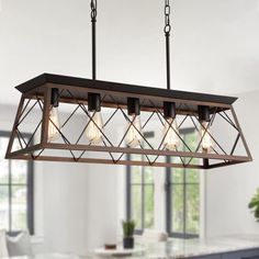 a light fixture hanging over a dining room table