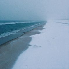 the beach is covered in snow and water