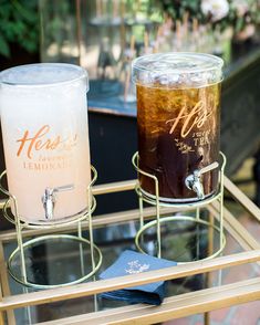 two drinks sitting on top of a glass table