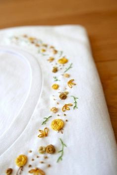 a white cloth with yellow flowers on it