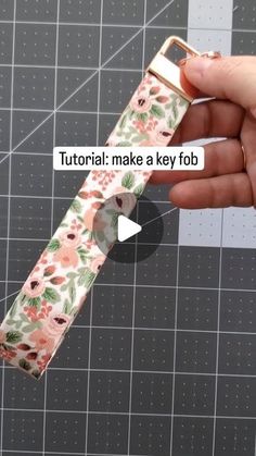 a person is holding an apple watch band with flowers on it and the text, how to make a key fob