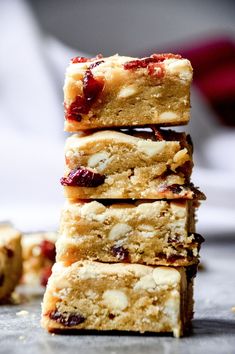 several pieces of food stacked on top of each other with cranberry toppings