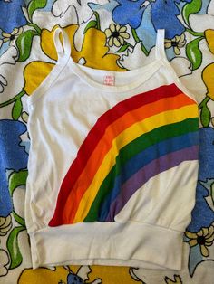 Vintage 70s 80s Rainbow tank top, Joey Ey Joe Joey tank top 1970s 1980s, vintage rainbow clothing, retro rainbow top Joey Ey Joe Joey rainbow tank top! from the 70s/80s made in the USA 50% polyester, 50% acrylic stated size large but please always go by measurements for best fit Measurements: 17" bust or 34" doubled it does stretch 17" top of shirt to bottom of shirt not including strap 20" top of strap to bottom of shirt 12.5" flat across bottom band of tank top- it does stretch Rainbow Clothing, Rainbow Tank Top, Rainbow Top, Rainbow Outfit, Rainbow Shirt, Retro Rainbow, Vintage Rainbow, 1980s Vintage, True Vintage