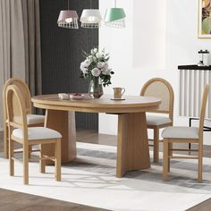 a wooden table with chairs around it and a vase on the table next to it