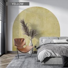 a bed room with a neatly made bed and a chair next to the wall that has a yellow circle on it