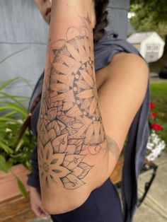 a woman with a tattoo on her arm