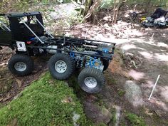 an off - road vehicle is parked in the woods