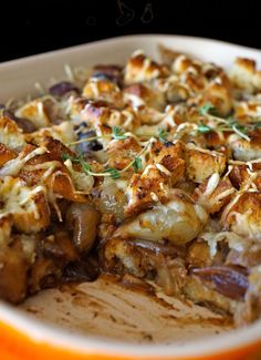 a casserole dish with meat, cheese and vegetables