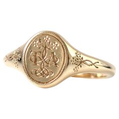 Crafted in 9ct and 18ct gold, the Forget-Me-Not Signet ring is a timeless symbol of love and remembrance. Inspired by Victorian sentimental jewelry, this ring features two letters of your choice, intertwined with delicate Forget-Me-Not flowers, a cherished symbol of enduring affection. The floral design extends down the shank, adding a touch of elegance and sentimentality. At Mayveda, we believe in creating modern heirlooms that tell your story. The Forget-Me-Not Signet is a romantic piece, designed to keep the memory of a loved one close, while also reflecting your personal connection through the engraved letters. The inside of the ring bears the inscription "I love in earnest,” a nod to Victorian devotion, which can be personalized with your own message, making this piece uniquely yours. Small Gold Signet Ring, Signet Ring Gold Women, Delicate Signet Ring, Initial Signet Rings Women, Vintage Wedding Rings Mens, Signet Ring Antique, Simple Engraved Rings, Embossed Engagement Ring, Initial Engraved Ring