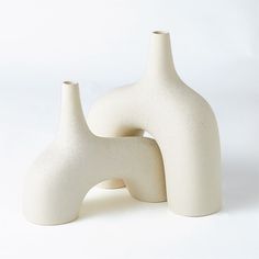 Dimensions: Large: 13"L x 4"W x 13"H (3.1 lbs) Small: 13"L x 4"W x 10"H (2 lbs) Color: Cream Materials: Ceramic Dust with dry cloth Product is not Watertight Reminiscent of the 1960's lava glaze ceramics, The Stretch Vases are slip cast vessels that nest/straddle each other. France and Son is an authorized seller of this product. Cream Stone, Interior Design Awards, Large Armchair, Glaze Ceramics, Global Views, Table Vases, Kathy Kuo Home, Boho Home, Large Vase