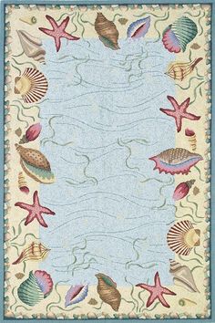 an area rug with seashells and starfish on the border, in blue