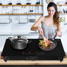 a woman is cooking on the stove with her pan and frying pan in front of her