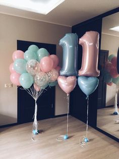 balloons are arranged in the shape of the number one