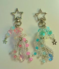 two pairs of dangling earrings with stars and beads