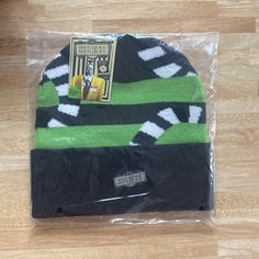 Green Black Stripes With Black White Sandworm Arms Throughout Beetlejuice Beanie B23 Beetlejuice Sandworm, Beetlejuice, Baseball Caps, Warner Bros, Beanie Hat, Beanie Hats, Black Green, Black Stripes, Baseball Cap