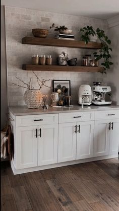 a kitchen with white cabinets and open shelves