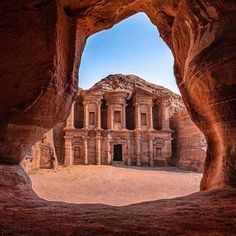 an ancient building in the middle of a desert