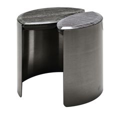 a black and silver table with a circular top