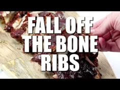 someone is cutting up some food on a wooden board with the words fall off the bone ribs