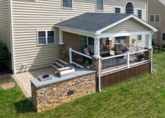 a house with a covered patio in the yard