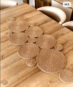 a wooden table topped with lots of place mats