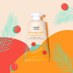 a bottle of coconut hand cream sitting on top of an orange and green background with palm leaves