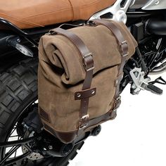 a brown bag sitting on the back of a motorcycle