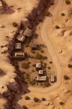 an aerial view of a small village in the middle of some desert land with trees and bushes