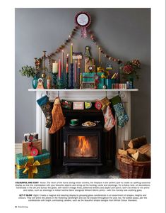 the fireplace is decorated with christmas stockings and candles