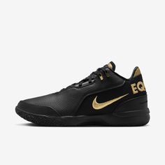 a black and gold shoe with the word eq on it