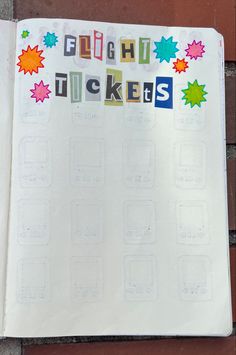 an open notebook with stickers on it and the words laugh, tickes written in multicolored letters