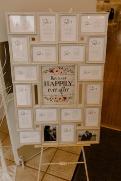 a wedding seating chart is displayed on a stand