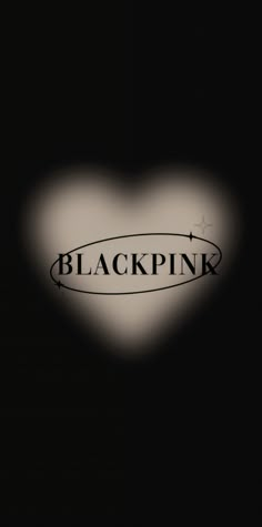 the word blackpink is written on a heart shaped object with an arrow in it